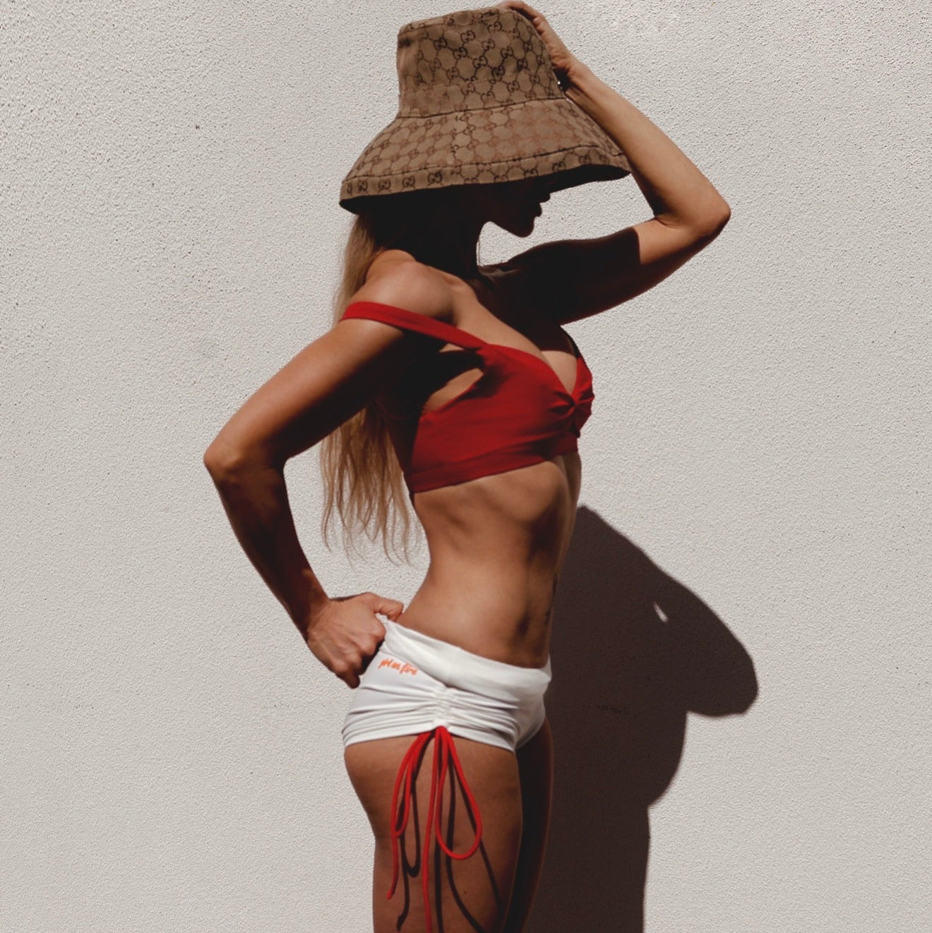 Angelica Jansen wearing a Gucci Hat in Nini Bra and Neli Short by GOF 