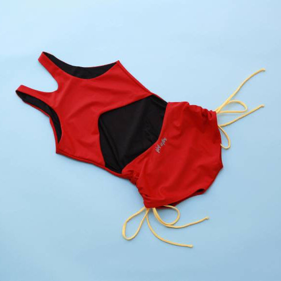 The Jane Shortie in Red Love with yellow strings on a light blue background