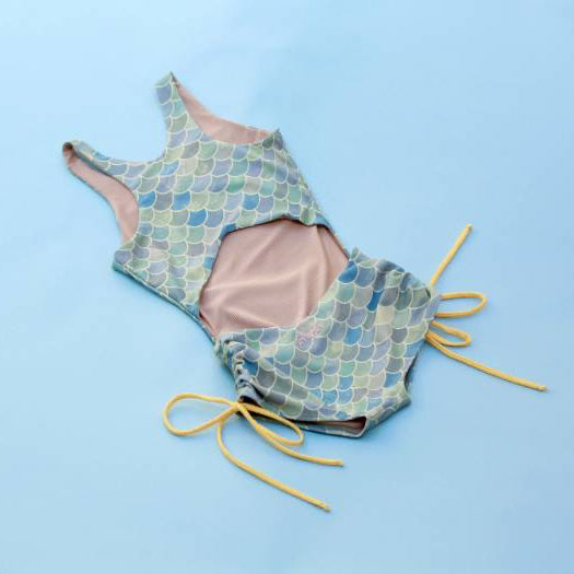 The Jane Shortie with mermaid pattern on a blue background
